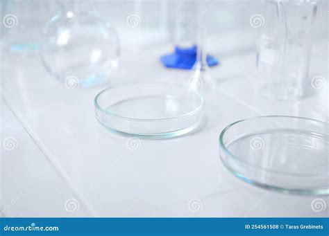 Plate Or Petri Dish With Glass Beaker With Water In Microbiology