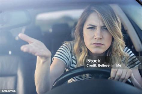 Angry Woman Driving A Car Stock Photo Download Image Now Boredom