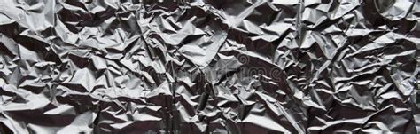 Crumpled Silver Aluminum Foil Closeup Background Texture Abstract