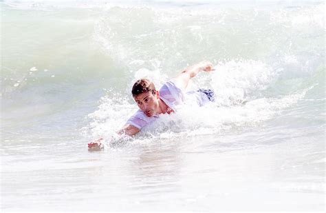 Dlisted Rob Lowe Seen Body Surfing In Malibu Ca