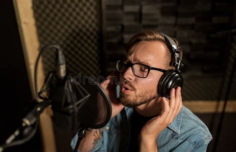 Man With Headphones Singing At Recording Studio Stock Image Image Of