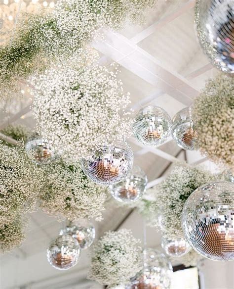 Funky Yet Pretty Dance Floor Ceiling With Disco Balls And Babys Breath