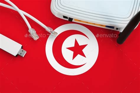 Tunisia Flag Depicted On Table With Internet Rj Cable Wireless Usb