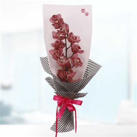 Red Cymbidium Bouquet Online Flower Delivery Qatar | BTF