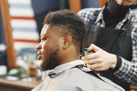 Man Getting His Hair Cut at a Barber Shop · Free Stock Photo