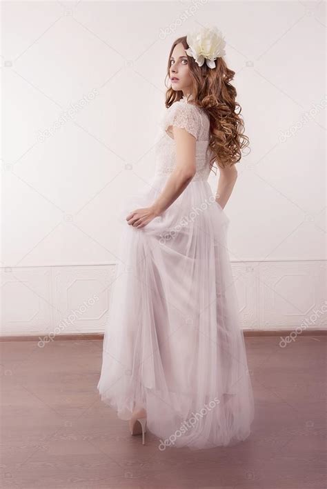 Girl In White Dress And With White Flower In Her Hair Stock Photo