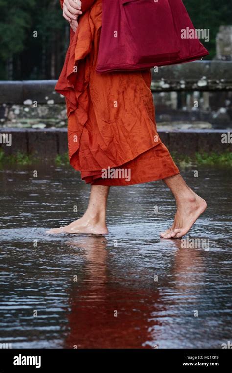 Buddhist Monk Walking On Water Angkor Cambodia Stock Photo Alamy