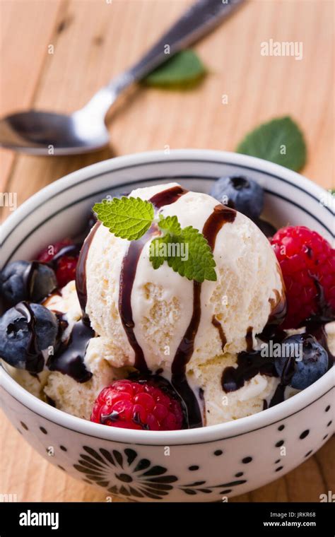 Vanilla Ice Cream With Fruits In A White Bowl Stock Photo Alamy