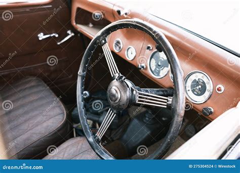 Classic Car With Its Old Steering Wheel Control Panel And Dashboard