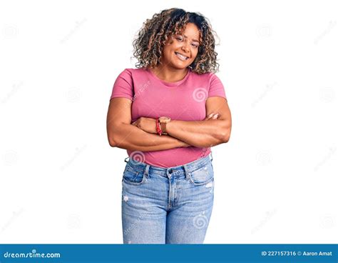 Young African American Plus Size Woman Wearing Casual Clothes Happy