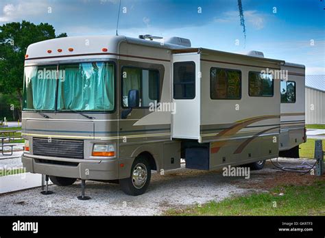 Front And Side View Of A 32ft Class A Motorhome With Slideouts At A