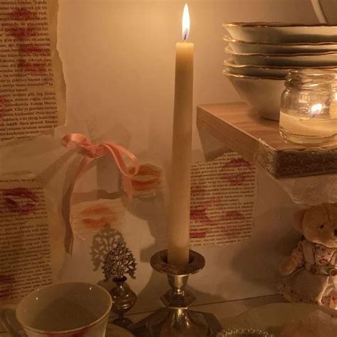 A Lit Candle Sitting On Top Of A Table