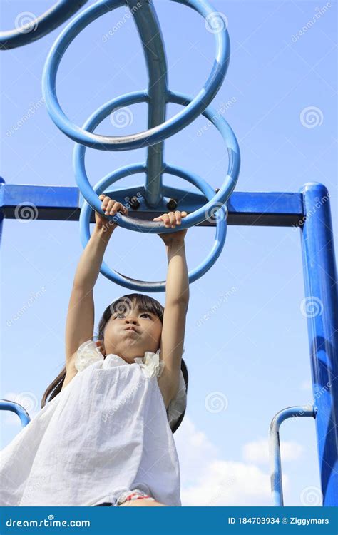 Japanese Girl Playing with a Monkey Bars Stock Photo - Image of playground, bars: 184703934