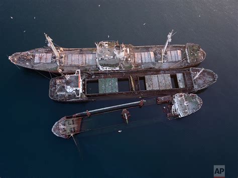 Greece Hauls Abandoned Half Sunken Ships Out Of The Sea Ap Images