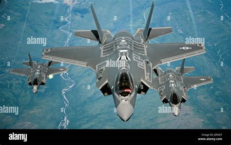 USAF F-35A Lightning II stealth fighter aircraft fly in formation over the Travis Air Force Base ...