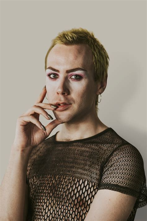 blond  binary person wearing makeup premium photo rawpixel