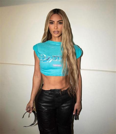 Kim Kardashian Shocks Fans As Her Abs Bulge Through Tiny Frame For New