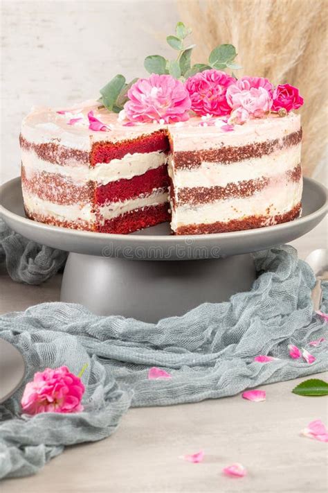 Red Velvet Naked Cake With Fresh Roses And Swiss Buttercream On Kitchen