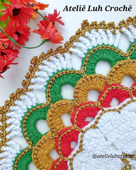 Crocheted Doily With Red And Green Flowers In The Background That Says