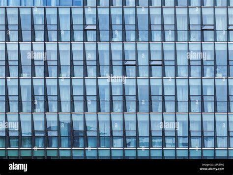 Modern Office Building Facade With Windows Blue Toned Glass And Steel