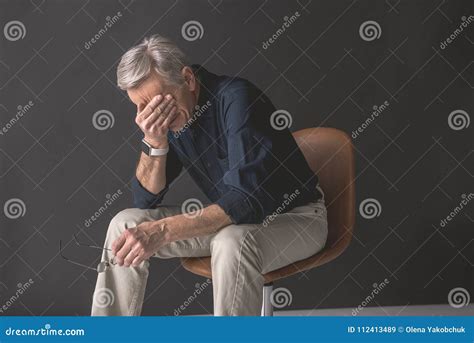 Weary Senior Male Sitting On Chair Stock Image Image Of Mature