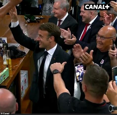 Emmanuel Macron downs a bottle of Corona in one while cheered on by ...