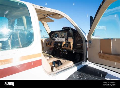 cockpit of small white propeller aircraft plane at blue sky Stock Photo ...