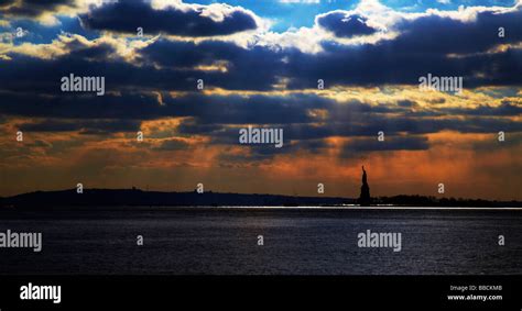 statue of liberty at sunset, New York Stock Photo - Alamy