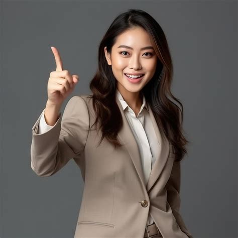 Premium Photo Excited Attractive Asian Female Saleswoman Standing In