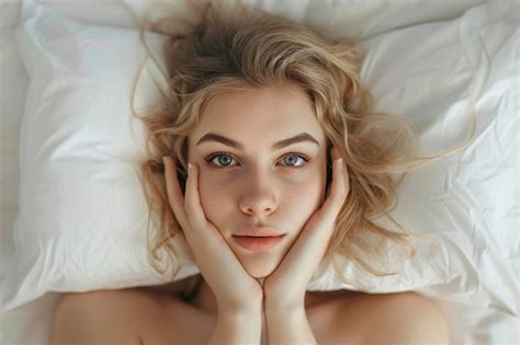 Premium Photo Woman Laying In Bed Under Blanket