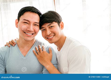 Young Happy Gay Couple In Love Proposing And Marriage Surprise Show A Wedding Ring In The