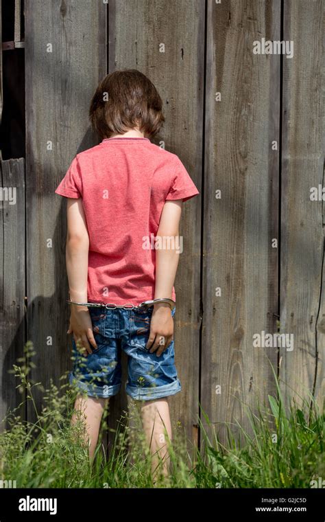 Child handcuffs hi-res stock photography and images - Alamy