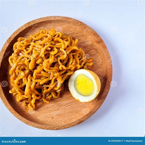 Fried Noodles With Boiled Egg Pieces On A Wooden Plate Stock Image Image Of Meal Meat 294334577