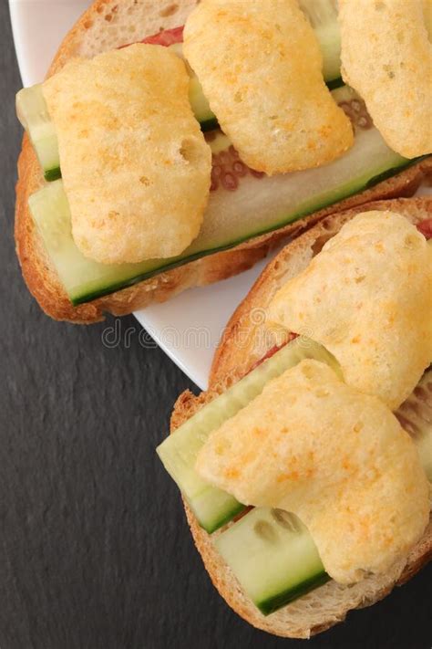 Sandwiches With Bread Slices Cheese Cucumber And Crisps On Plate Stock