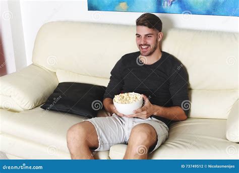 Young Man Eating Popcorn And Watching Movies Stock Photo Image Of