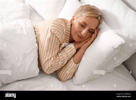 Mature Woman Sleeping In Bed Stock Photo Alamy