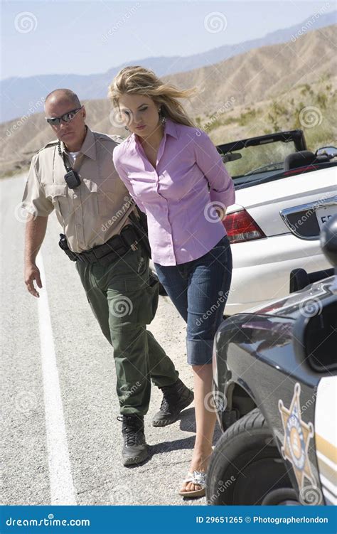 Woman Police Officer Arresting