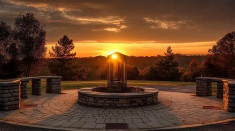 Premium AI Image | A sunset view of the park with a fountain in the ...