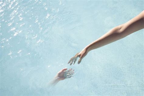 Touch Reflection Of A Woman Hand Touching Water Illusion Of Two Hands