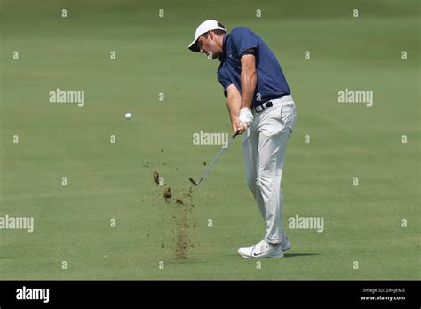 Scottie Scheffler Hits An Approach Shot On The First Hole During The Final Round Of The Charles