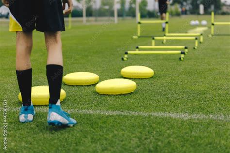 Soccer training equipment. Footballer ready to practice. Player is sportswear and soccer cleats ...