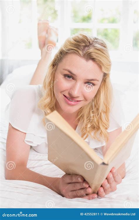Pretty Blonde Lying On Bed Smiling At Camera With Book Stock Image Image Of Spare Lying 42552811