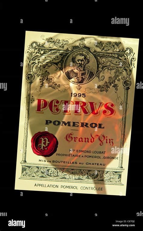 Petrus Wine Label Shadow Of Wine In Glass Swirling Falling On Label Of