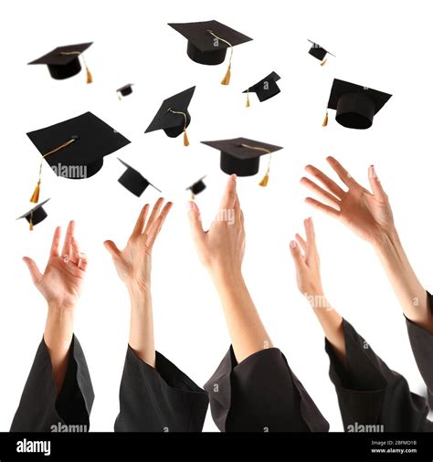 Graduates Hands Throwing Graduation Hats Isolated On White Stock