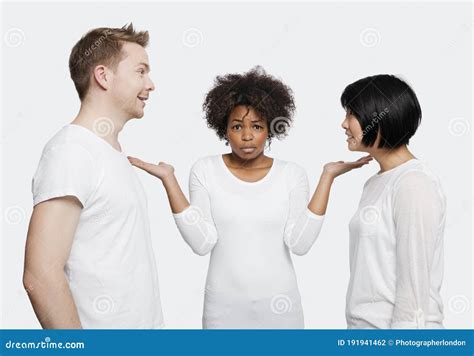 Portrait of Young African American Woman Being Ignored by Friends Over White Background Stock ...