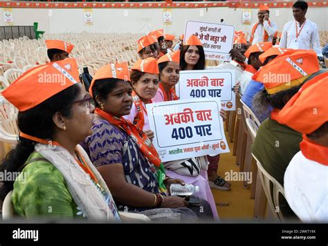 Party Workers Pose For A Photo Holding Placards At A Bharatiya Janata