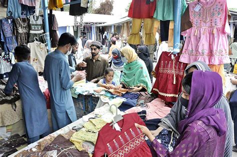 ISLAMABAD: Women selecting and purchasing dresses for preparation of ...