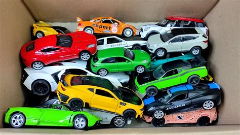 Box Full Of Model Cars Lamborghini Mclaren Lexus Lm H Porsche