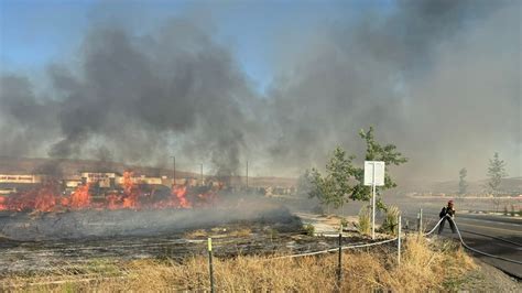 Firefighters Extinguish Brush Fire Near Winco On Pyramid Highway