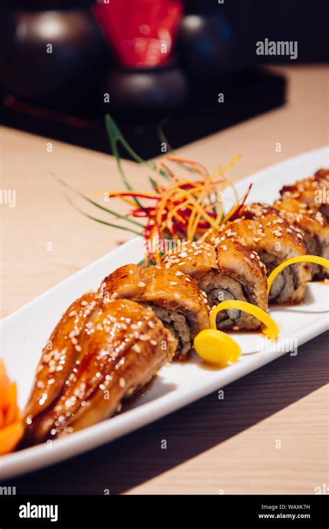 Beautiful Pieces Of Japanese Grilled Unagi Maki Roll On White Plate